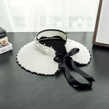 Spring and summer ladies vacation travel big pearl bow straw woven empty top hat UV protection beach hat