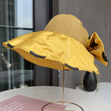 Summer ladies sunscreen breathable empty top hat with a large bow can accommodate a large brim sun hat