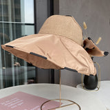 Summer ladies sunscreen breathable empty top hat with a large bow can accommodate a large brim sun hat